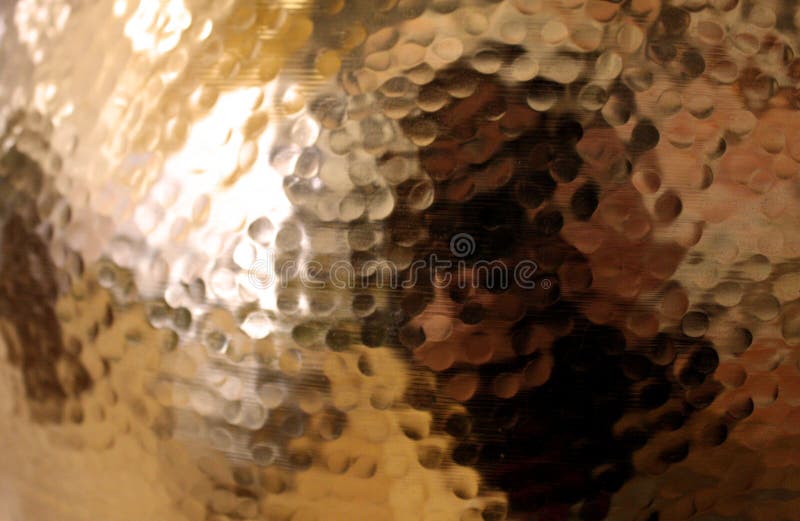 Hammered Gold Metal Pot Close up Detail with reflective surface. Hammered Gold Metal Pot Close up Detail with reflective surface