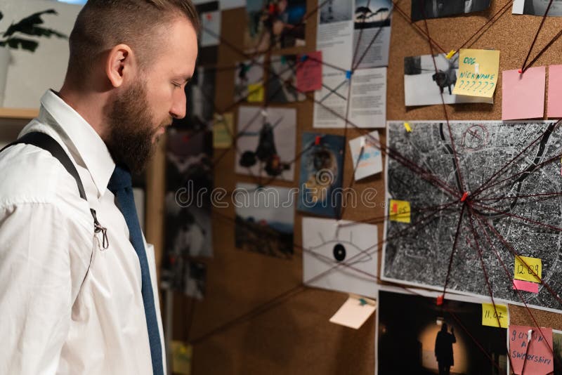 Detective Looking at Evidence Board with Crime Scenes, Photos of