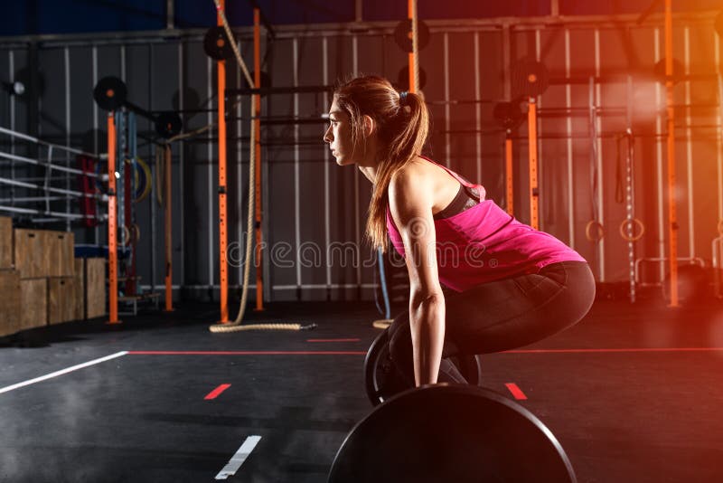 Athletic Girl Works Out at the Gym with a Barbell Stock Photo - Image ...