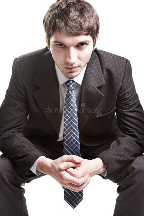 Determined young businessman over white stock image