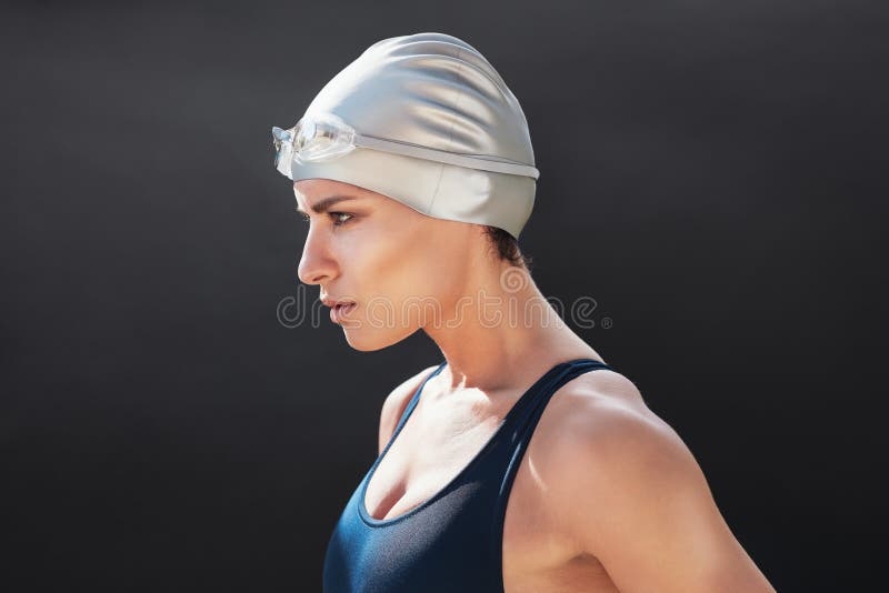 Determined young female swimmer stock image