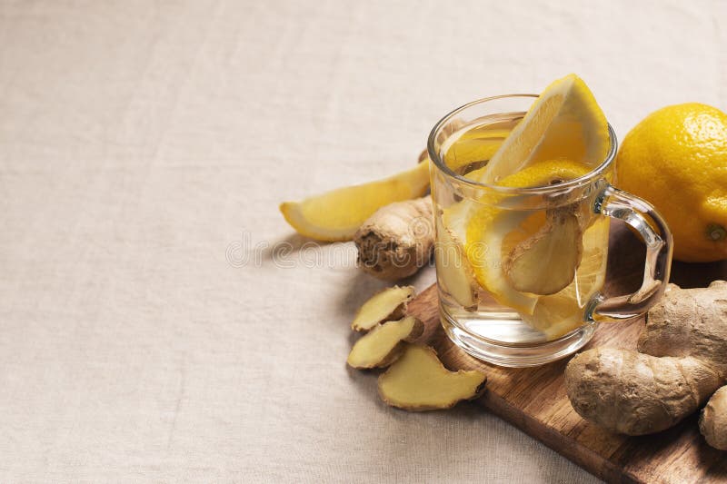 Detox and diet ginger drink with lemon in glass