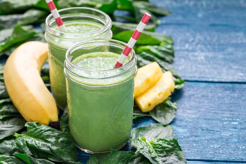 Detox green smoothie with spinach, pineapple, banana and yogurt, copy space royalty free stock images Detox green smoothie with spinach, pineapple, banana and yogurt, copy space royalty free stock images