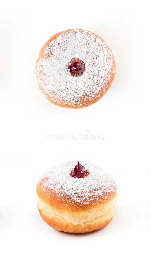 Dettaglio del primo piano della ciambella saporita con polvere ed inceppamento, isolato su fondo bianco fotografia stock Dettaglio del primo piano della ciambella saporita con polvere ed inceppamento, isolato su fondo bianco fotografia stock