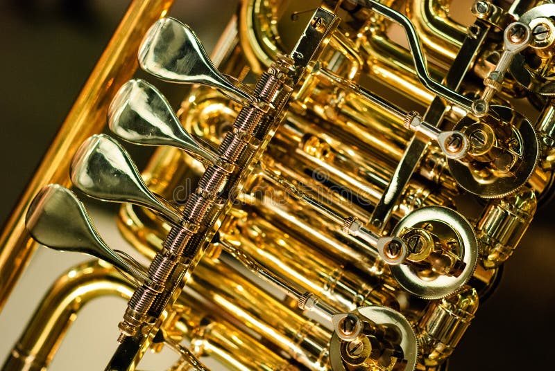 Golden brass instrument mechanic detail. Golden brass instrument mechanic detail