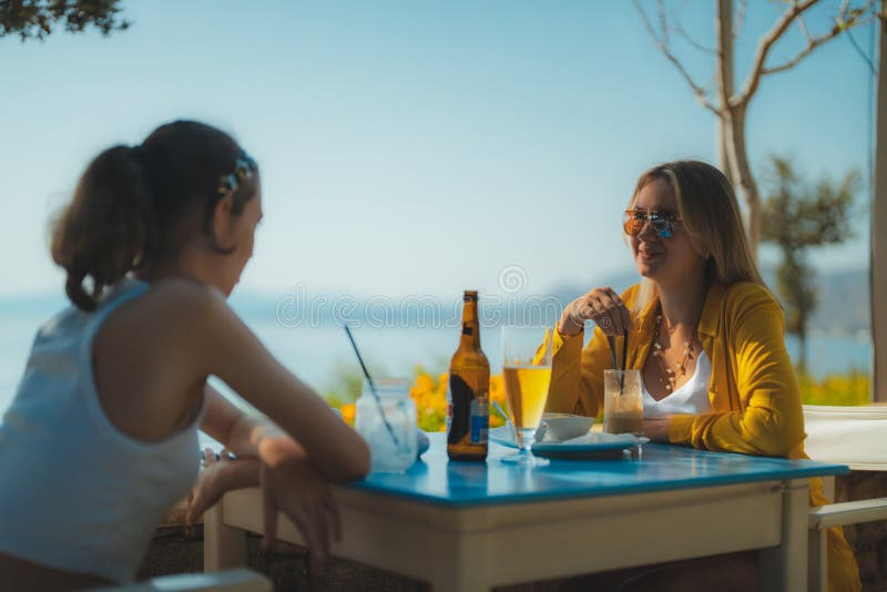 Two girls talking in a bar. Two girls talking in a bar