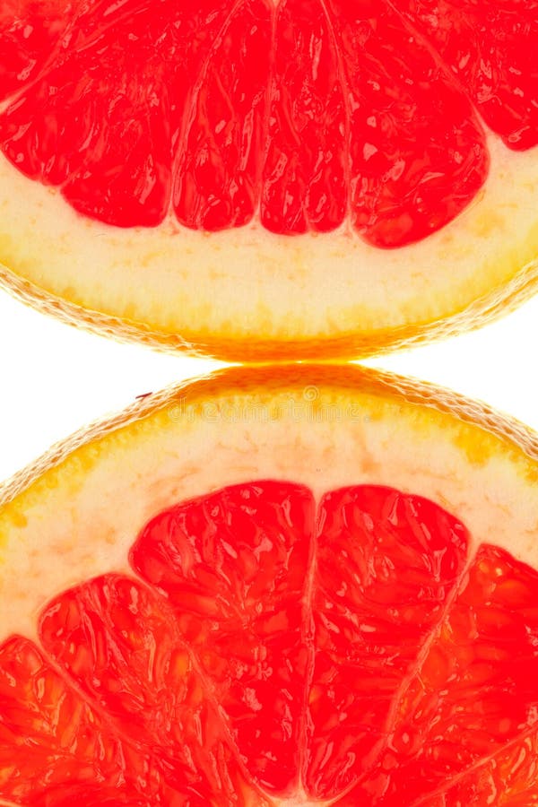Macro shot of two quarter slice of grapefruit. Macro shot of two quarter slice of grapefruit