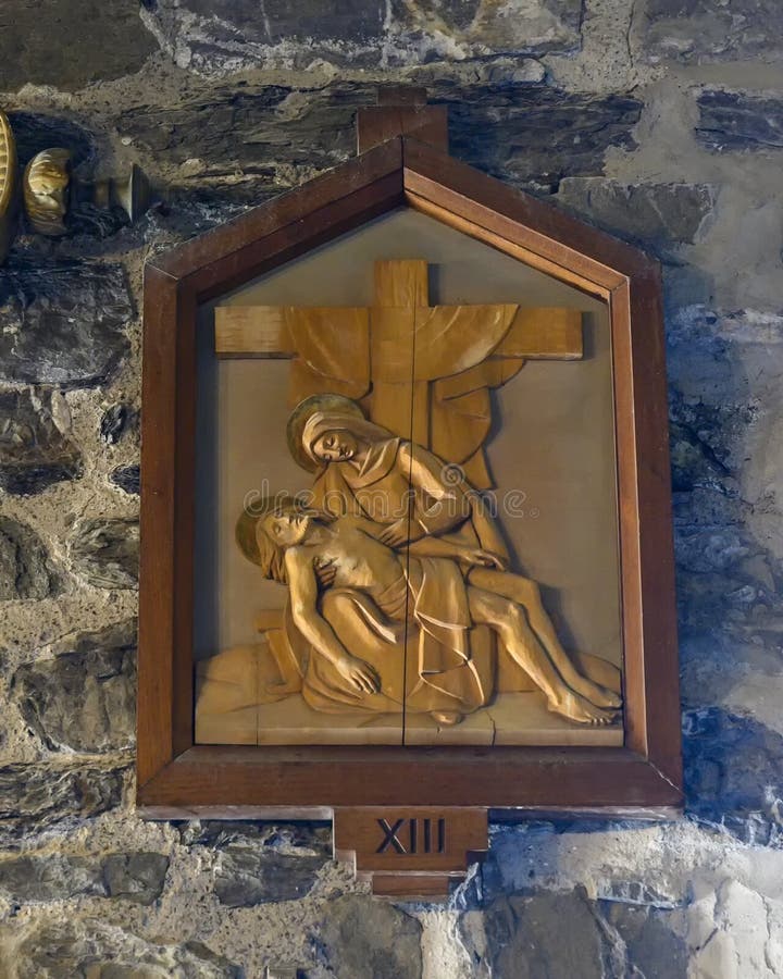 Pictured is the 13th Station of the Cross in the Church of Santa Margherita d`Antiochia.  Jesus is taken down from the cross.  The church is located in the seaside village of Vernazza, near the main square of the town, Piazza Guglielmo Marconi.  The first church on this site was built in the 11th century.  The current church is mentioned for the first time in a document in 1318.  It has had multiple renovations including a 19th century creation of access to the church from the square, through a door built in the apse area. Pictured is the 13th Station of the Cross in the Church of Santa Margherita d`Antiochia.  Jesus is taken down from the cross.  The church is located in the seaside village of Vernazza, near the main square of the town, Piazza Guglielmo Marconi.  The first church on this site was built in the 11th century.  The current church is mentioned for the first time in a document in 1318.  It has had multiple renovations including a 19th century creation of access to the church from the square, through a door built in the apse area.