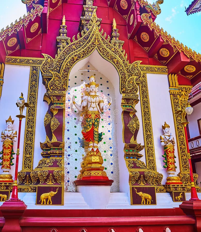 The statues of Devata deities decorate the backside wall of the splendid Ho Trai manuscript depository building of Wat Saen Muang Ma, Chiang Mai, Thailand. The statues of Devata deities decorate the backside wall of the splendid Ho Trai manuscript depository building of Wat Saen Muang Ma, Chiang Mai, Thailand