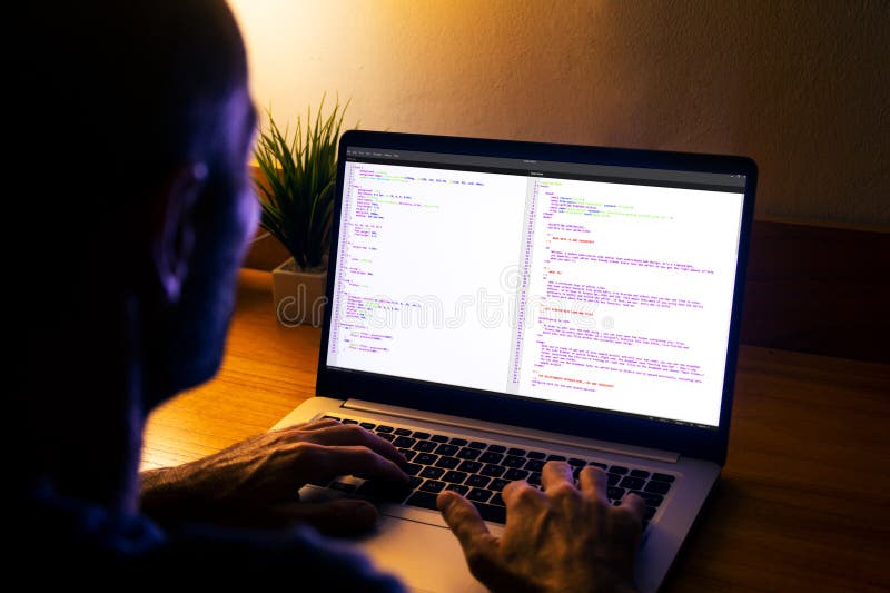 Developer programmer writing html javascript code in a laptop royalty free stock photo