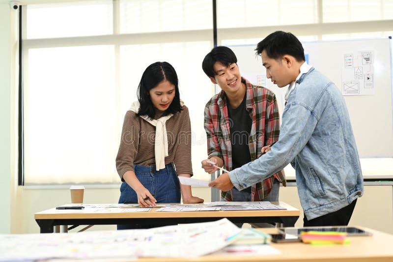 Developer team working on development project for mobile application at creative office. User experience concept royalty free stock photos
