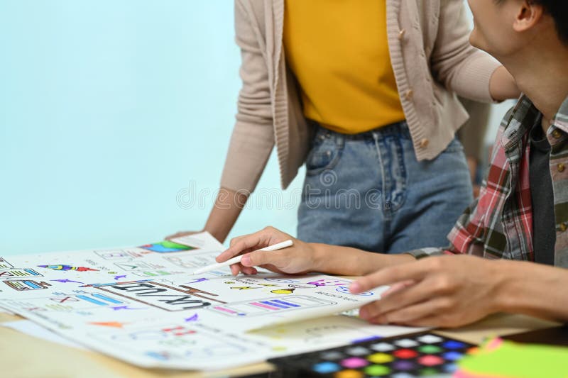 Developer team working on development project for mobile application at creative office. User experience concept stock photos