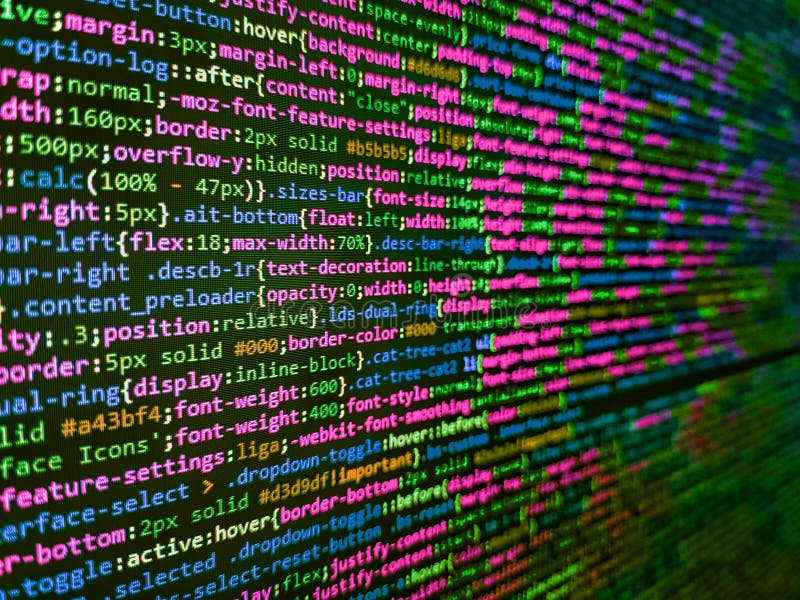 Developer working on websites codes in office. Blurred screen with selective focus. Programmer working in a software develop royalty free stock image