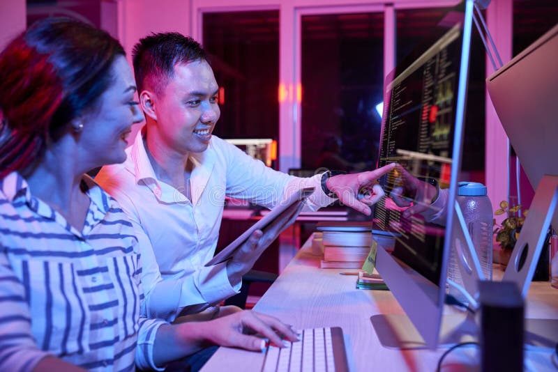 Developers Discussing Programming Code stock photography