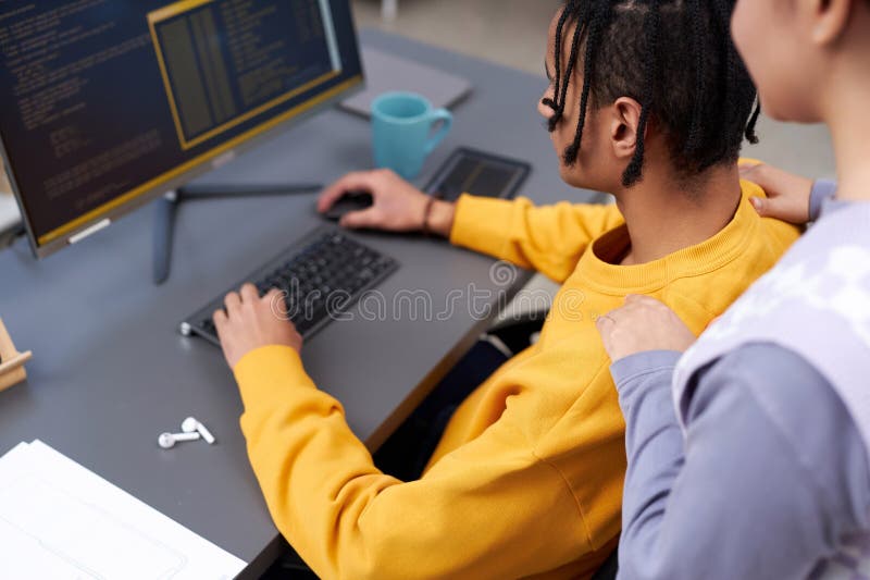 IT developers reviewing code together using compiter royalty free stock photo