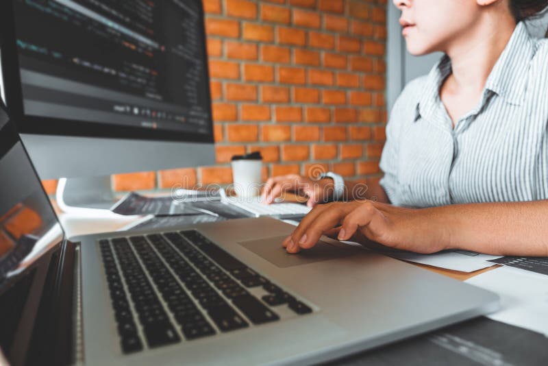 Developing Concentrated programmer reading computer codes Development Website design and coding technologies. Developing programmer stock images, royalty-free photos and pictures