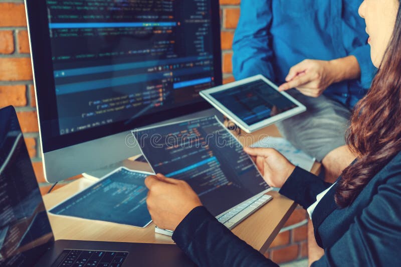 Developing programmer Team Development Website design and coding technologies working in software company office. Developing programmer stock images, royalty-free photos and pictures