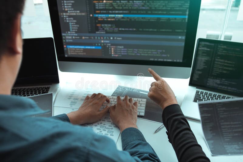 Developing programming and coding technologies working in a software engineers developing applications together in office royalty free stock photo