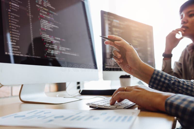 Developing programming and coding technologies working in a software engineers developing applications together in office royalty free stock images