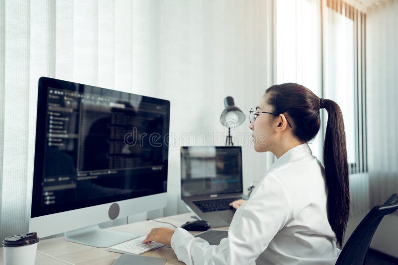 Developing programming and coding technology working in a software engineers developing applications in office.