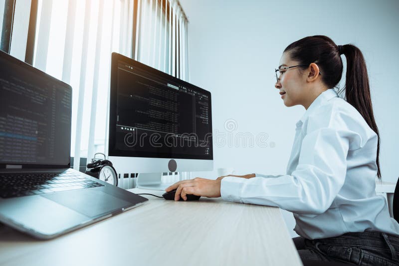 Developing programming and coding technology working in a software engineers developing applications in office stock photography