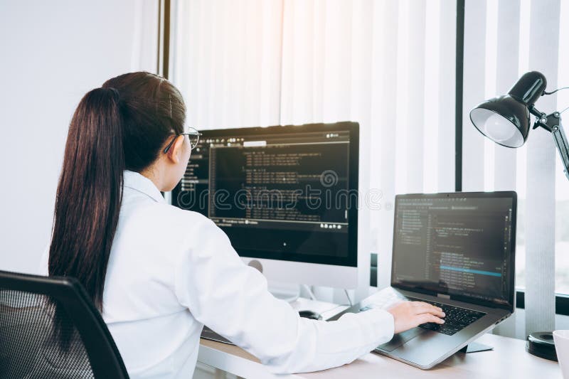 Developing programming and coding technology working in a software engineers developing applications in office stock photography