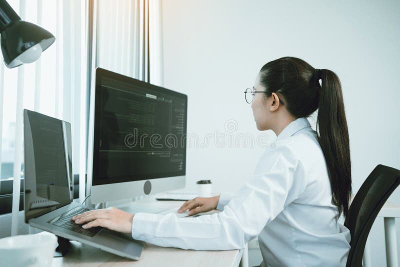 Developing programming and coding technology working in a software engineers developing applications in office stock images