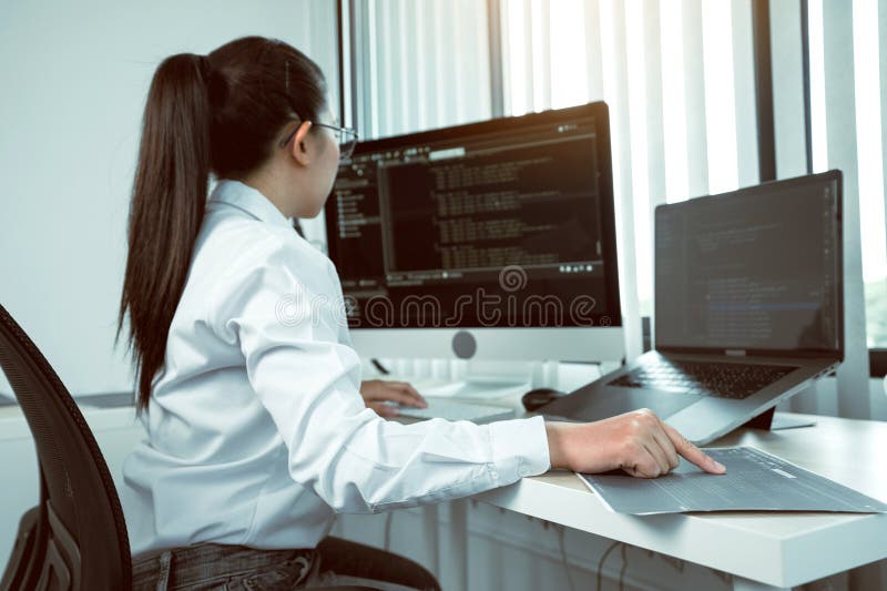 Developing programming and coding technology working in a software engineers developing applications in office stock photography