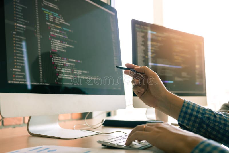 Developing programming working in a software engineers code tech applications on desk in office room stock photography