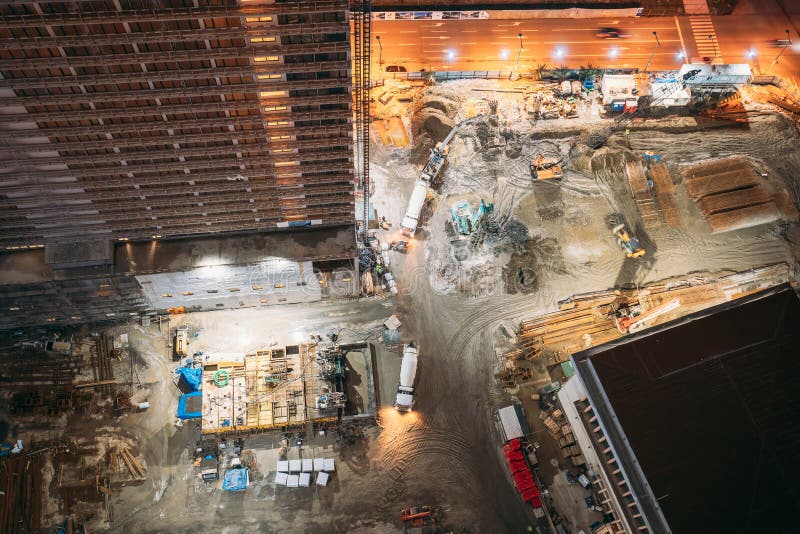 Development Multistorey Residential Building in Night Hours. Development on Construction Site