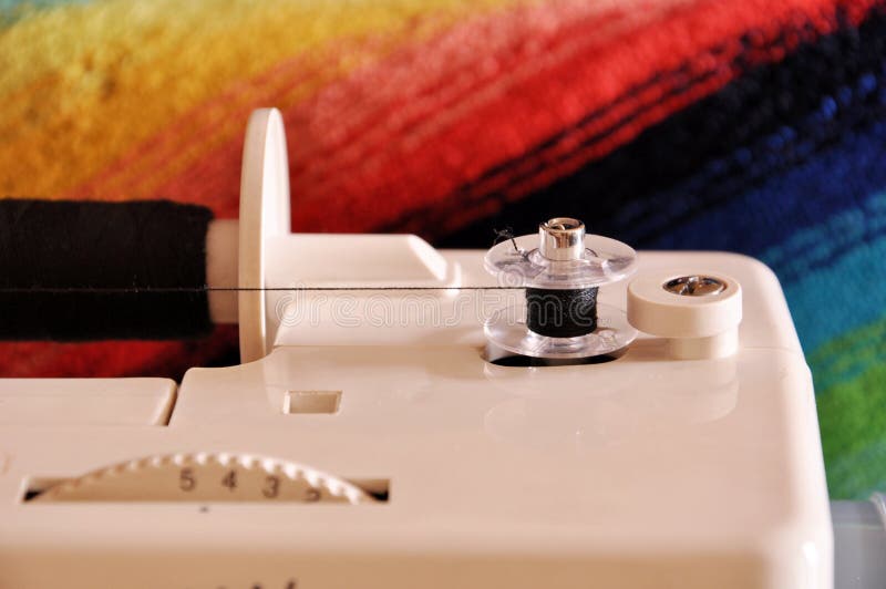 Device for Winding Thread on a Spool on a Sewing Machine Stock Photo