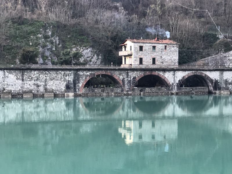 Devil Bridge Surrounded by Hills Covered in Greenery and Houses