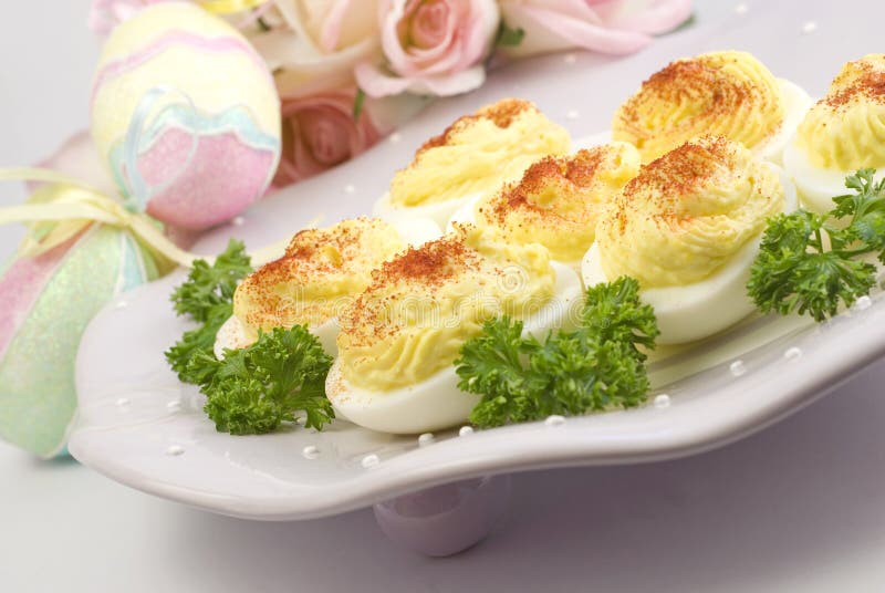 Deviled Eggs on Easter Plate with Decorations royalty free stock images