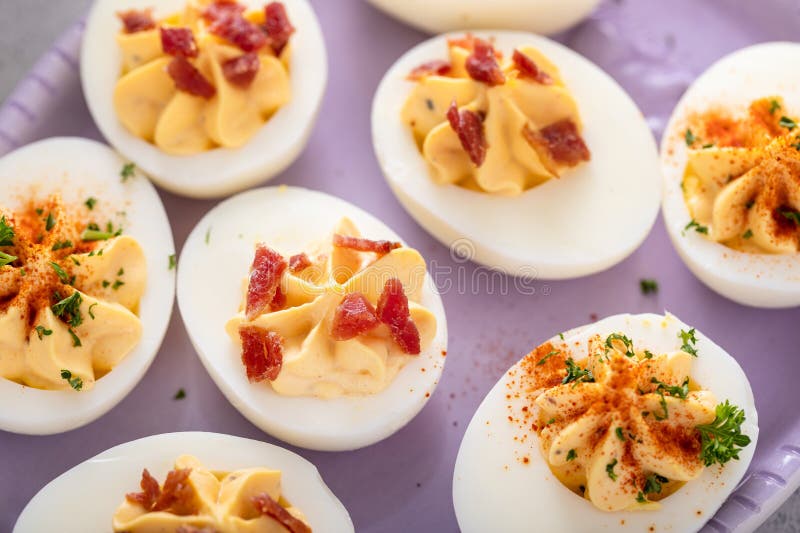 Deviled eggs with paprika and bacon, appetizer idea royalty free stock photography