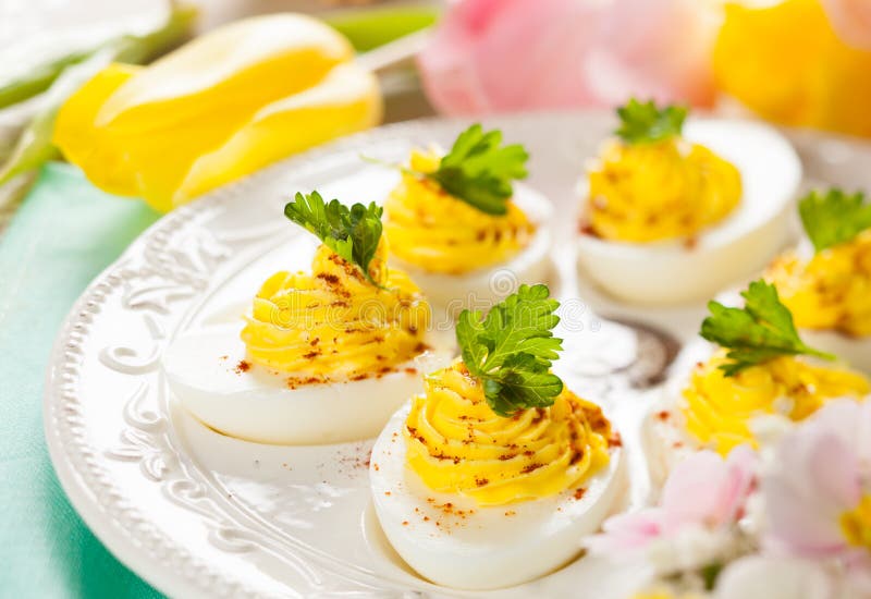 Deviled eggs with paprika stock photo. Image of green 37413538