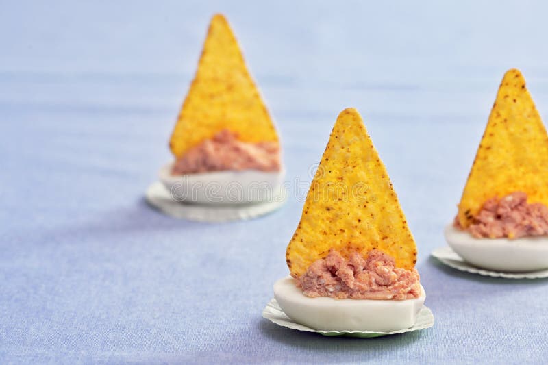 Deviled Eggs with Tortilla Chips Like Sailing Yachts Stock Photo