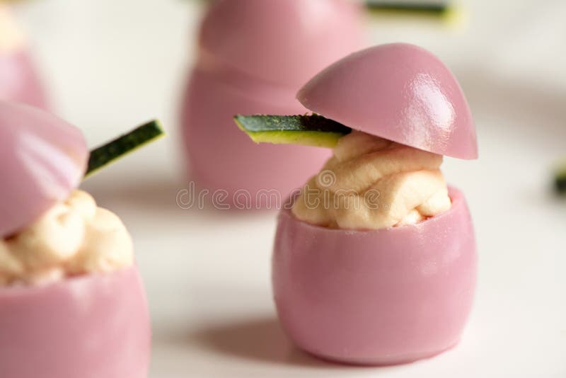 Deviled Quail Eggs with Cream Cheese, Dyed with Beet Juice. Stock Image