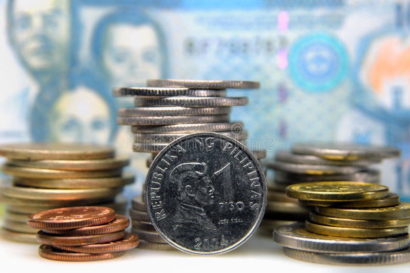 Philippine peso coins in front of a banknote. Philippine peso coins in front of a banknote