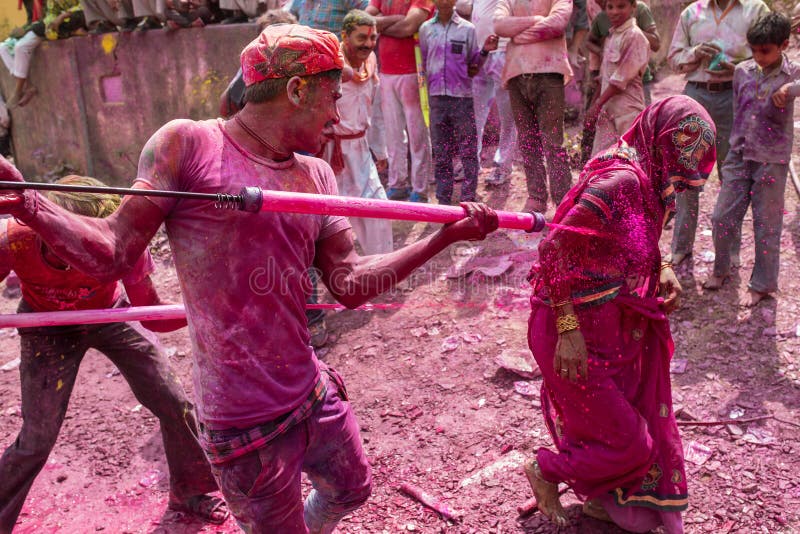 Devotees celebrate Lathmar Holi in Barsana village, Uttar Pradesh, India.