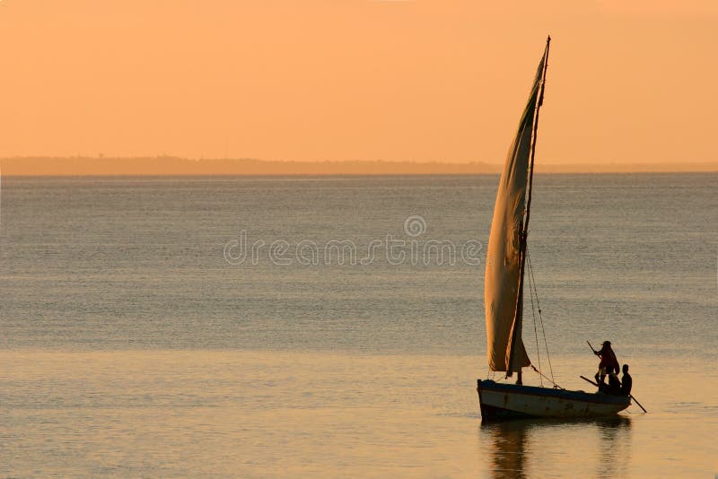 Traditional sail boat called a dhow at sunset, Vilanculos coastal sanctuary, Mozambique. Traditional sail boat called a dhow at sunset, Vilanculos coastal sanctuary, Mozambique