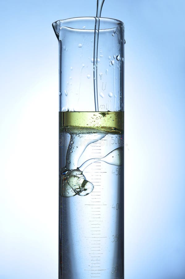 Oil flowing in a taste tube with water. Oil flowing in a taste tube with water