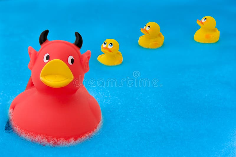 A devilish duck leading the ducklings astray. A devilish duck leading the ducklings astray.