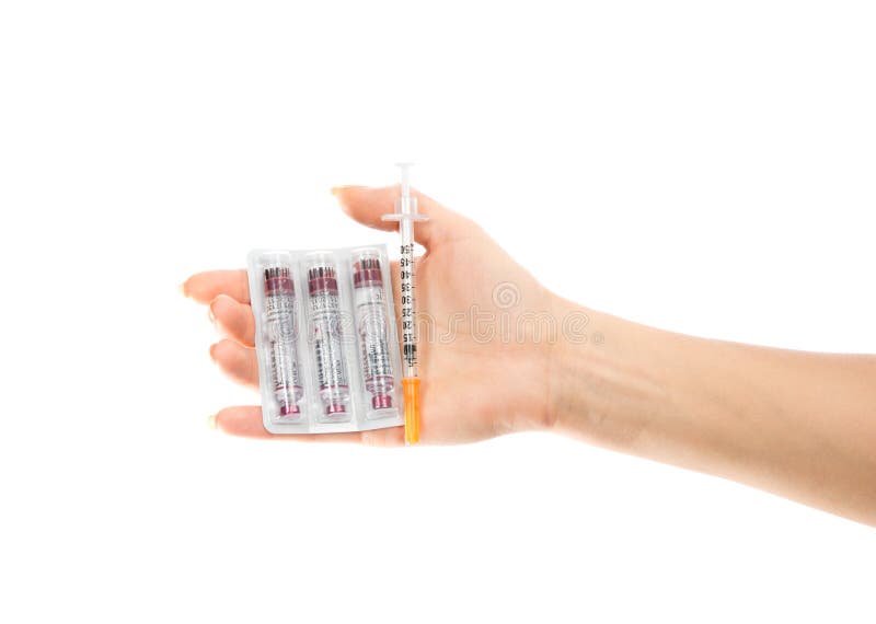 Diabetes concept. Hand with syringe injector and insulin vials stock photography