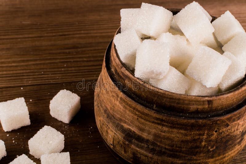 Diabetes. A lot of sugar cubes in jar.