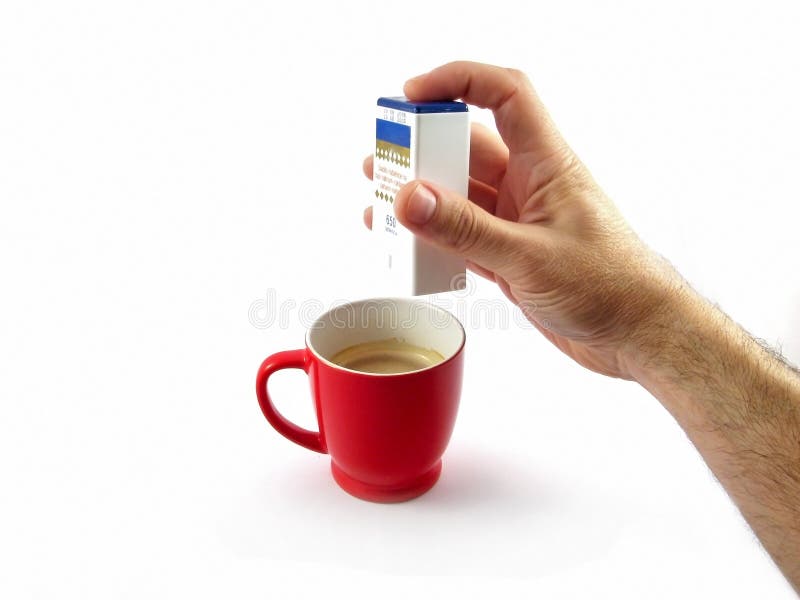 Diabetes sugar pill putting in coffee cup