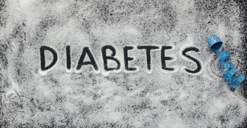 Diabeteswort geschrieben auf weißen zerstreuten Zucker stockbild Diabeteswort geschrieben auf weißen zerstreuten Zucker stockbild