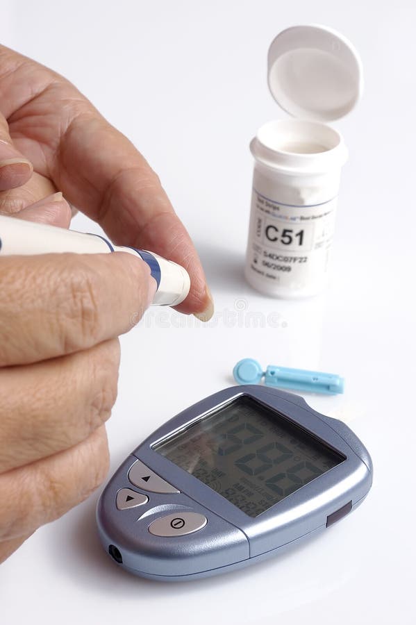 A diabetic testing her glucose level