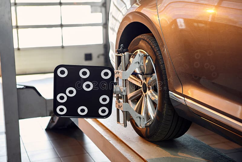 Diagnostics and Configuration Collapseconvergence. Car Wheels Alignment Equipment on Stand in a