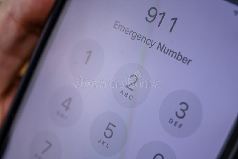 Calling 911 emergency number stock images