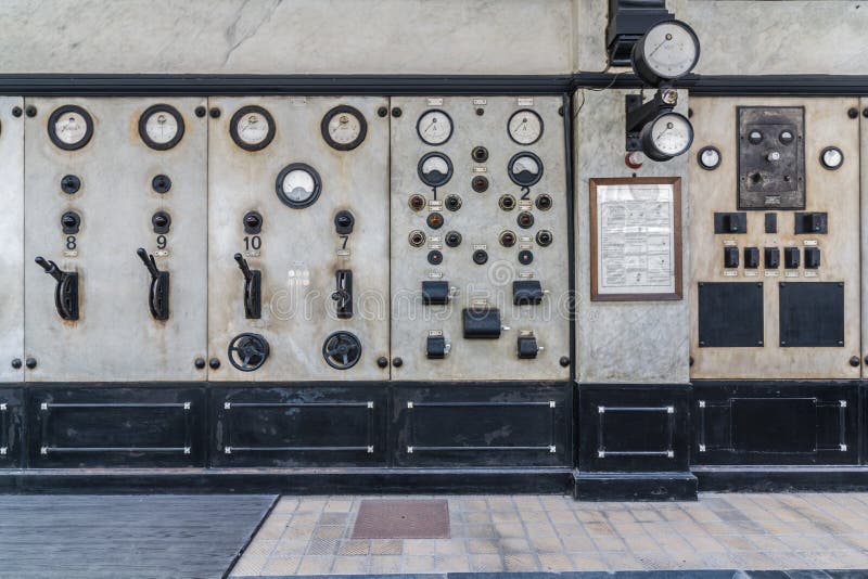 Dials and switches in the control room in old power plant. Control panel with measuring instruments